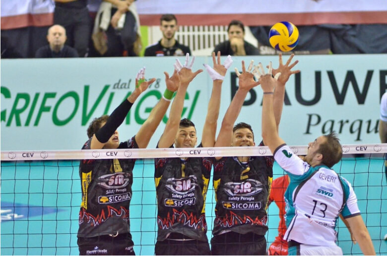 バレーボールの試合における激しいブロックシーン。コート上で繰り広げられるアスリートたちの躍動感あふれる攻防